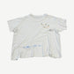 Paly Hollywood white cotton tee back view with raw faded edges and scattered sketch marks on jersey