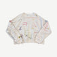 Paly Hollywood Good Times Are Over 2.0 cream crewneck front with hand-drawn portrait and text scribbles