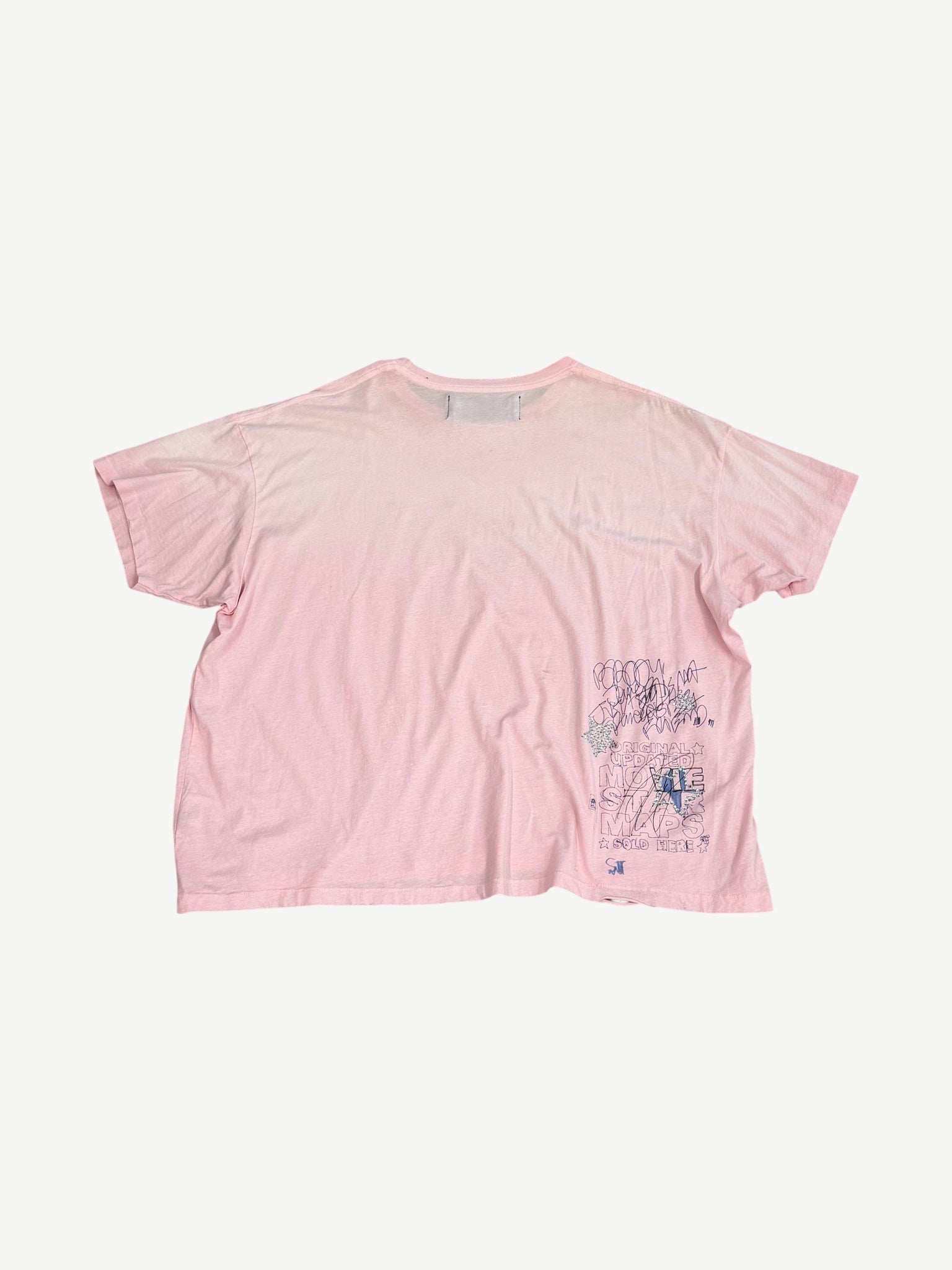 Paly Hollywood pink tee back view with hand-drawn scribble Movie Stars graphic at lower right hem