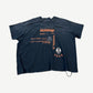 Paly Hollywood faded navy tee back with The Brown Derby premiere party text and orange Survival Is Love mugshot print.