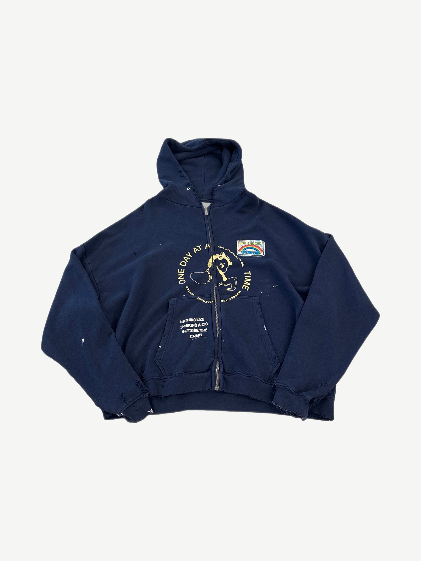 Paly Hollywood Treatment Center zip up hoodie in distressed navy with One Day At A Time print and rainbow patch.
