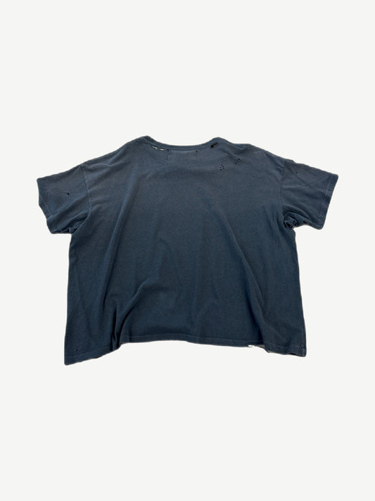 Paly Hollywood faded black distressed tee back view, plain panel with scattered moth holes and raw frayed hem.