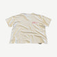 Paly Hollywood cream tee back view with small red Paly script print on upper back