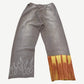 Paly Mass sweatpants back view in faded gray brown with orange tie-dye hem panel and rhinestone flame motif