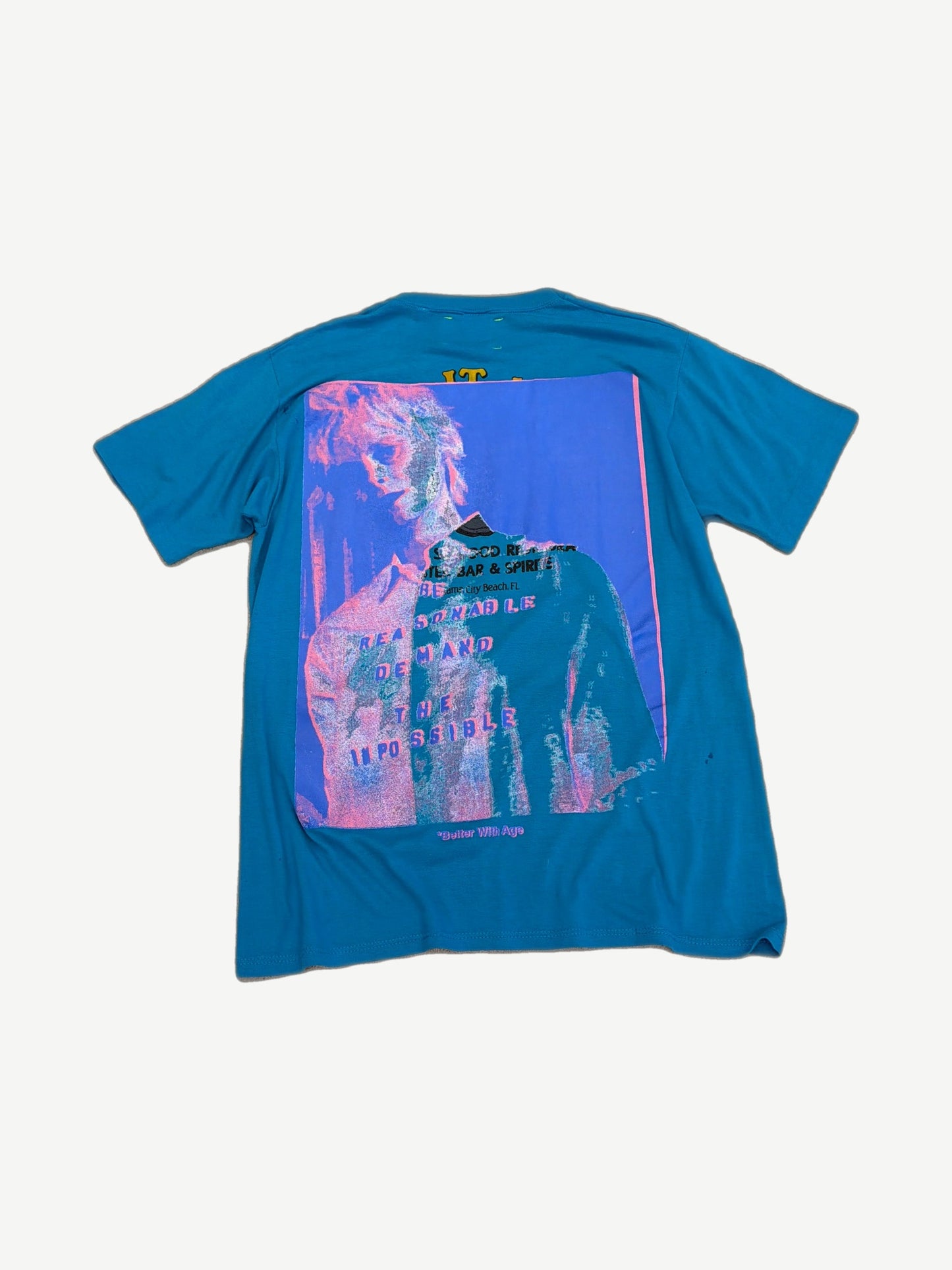 Better With Age teal Vivianne tee back view with large pink and blue distressed photo print graphic
