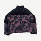 Back view of Louis Vuitton bimaterial down jacket with black fleece shoulders and purple monogram damier puffer panels