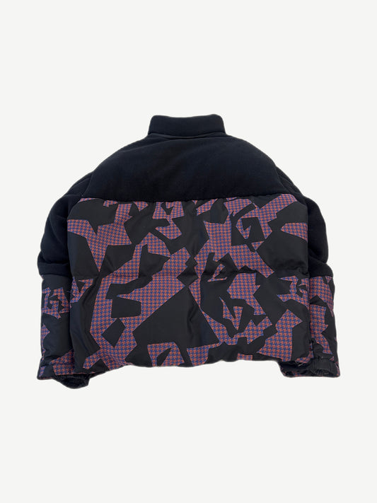 Back view of Louis Vuitton bimaterial down jacket with black fleece shoulders and purple monogram damier puffer panels