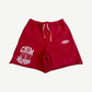 HMDD Happy Memories Don't Die red Chim Reapers mesh shorts with white screen-printed reaper graphic at leg.