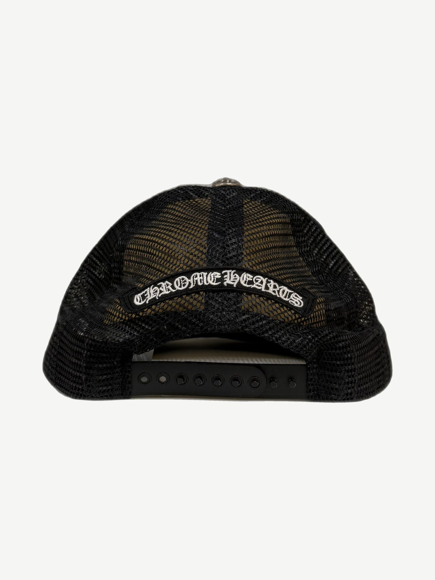 Back of Chrome Hearts black mesh trucker hat with gothic logo strap patch and adjustable snapback.