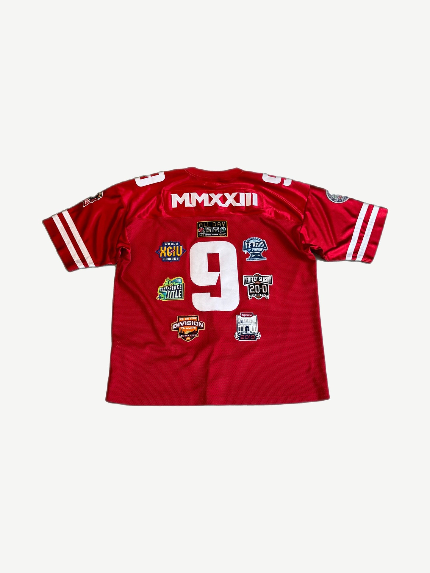 Supreme Championships football jersey back view in red mesh with large embroidered number and back graphic