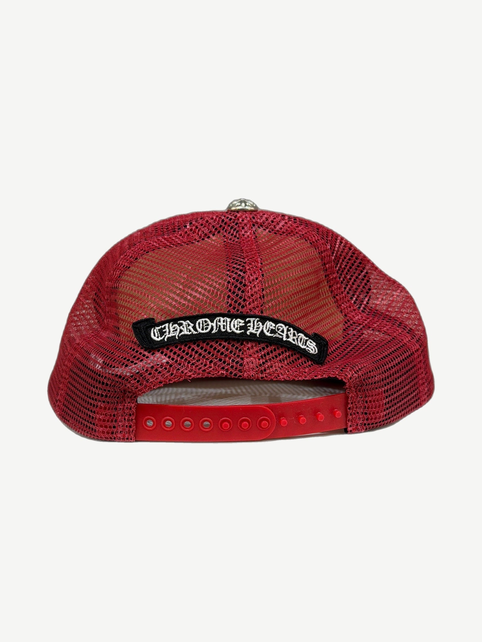Chrome Hearts red trucker hat back view with black Chrome Hearts gothic scroll patch on red mesh and snapback closure.