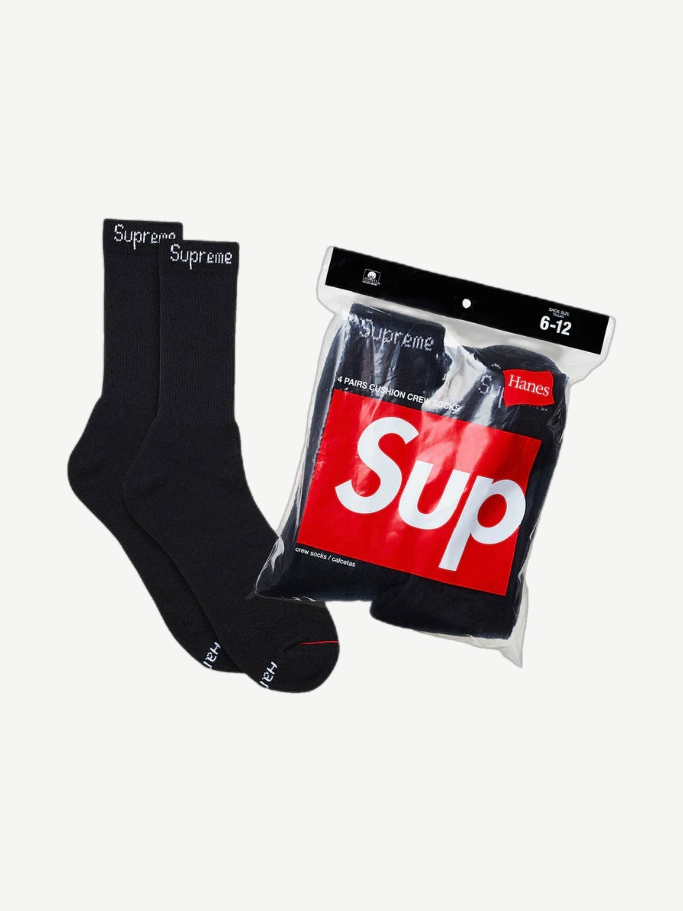 Supreme black Hanes cushion crew socks 4-pack with white logo cuffs shown beside sealed packaging with red box logo