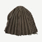 Reverse view of HMDD brown knit beanie showing folded cuff and woven brand label at back.