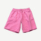 Supreme pink small box logo sweatshorts front view with red Supreme tag near hem on bright pink fleece