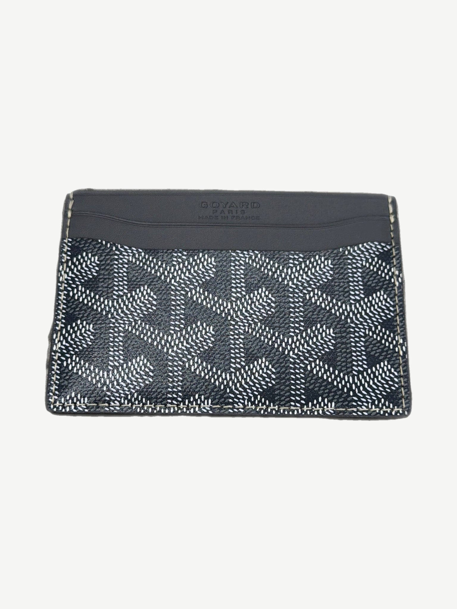 Goyard gray Saint Sulpice card holder open view showing interior card slots and chevron canvas lining