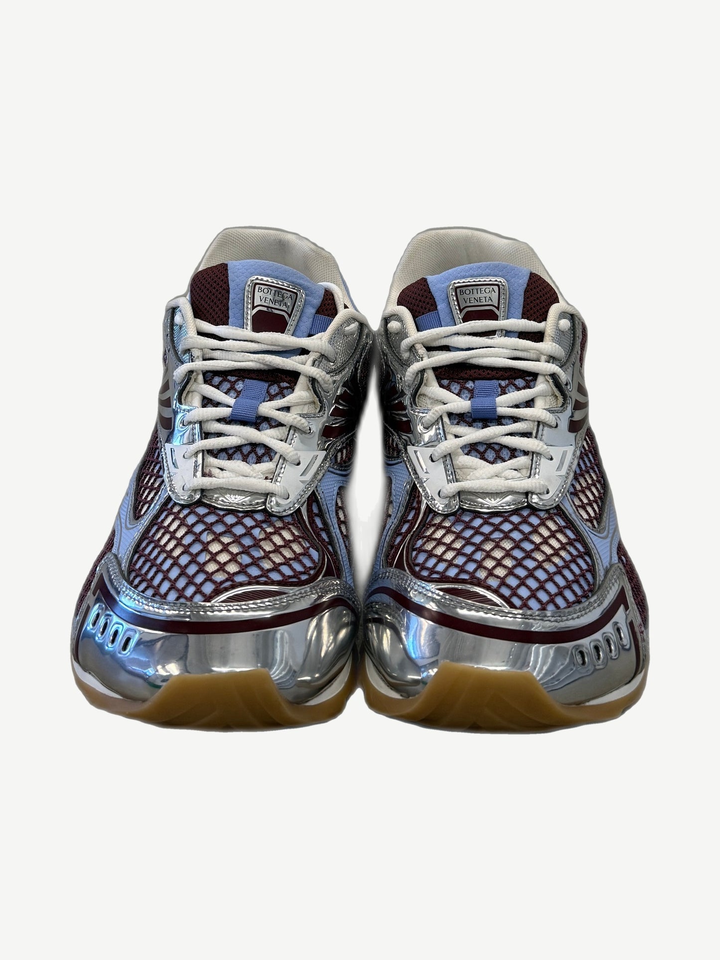 Bottega Veneta Orbit sneakers front view with blue tongue, white laces and silver chrome midsole detail.