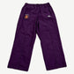 Supreme x Umbro plum cotton ripstop track pants front with Supreme World Famous crest and Umbro diamond logo.