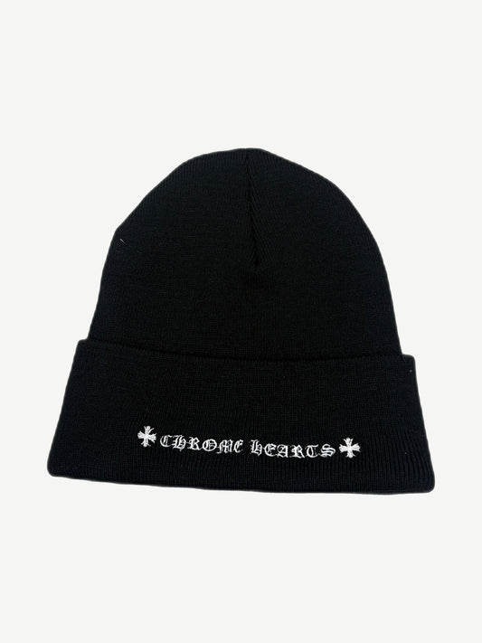 Reverse of Chrome Hearts black beanie showing Chrome Hearts script and dagger logos embroidered on cuff