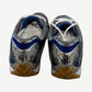Bottega Veneta Orbit sneakers rear view showing mirrored silver heel cups and royal blue accent panels
