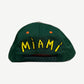 Chrome Hearts Miami baseball cap back, green panel with yellow MIAMI script and adjustable snapback closure.