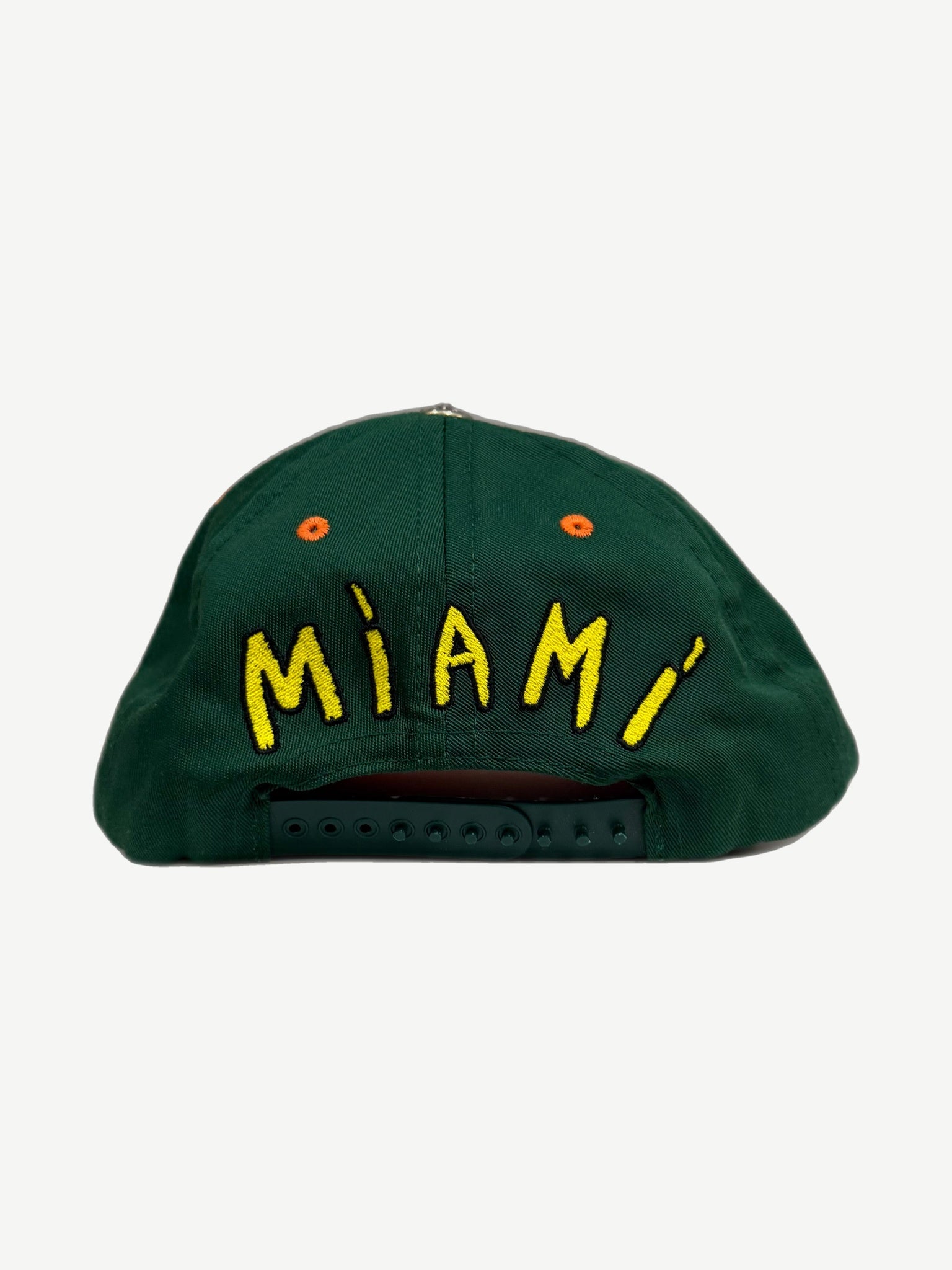 Chrome Hearts Miami baseball cap back, green panel with yellow MIAMI script and adjustable snapback closure.