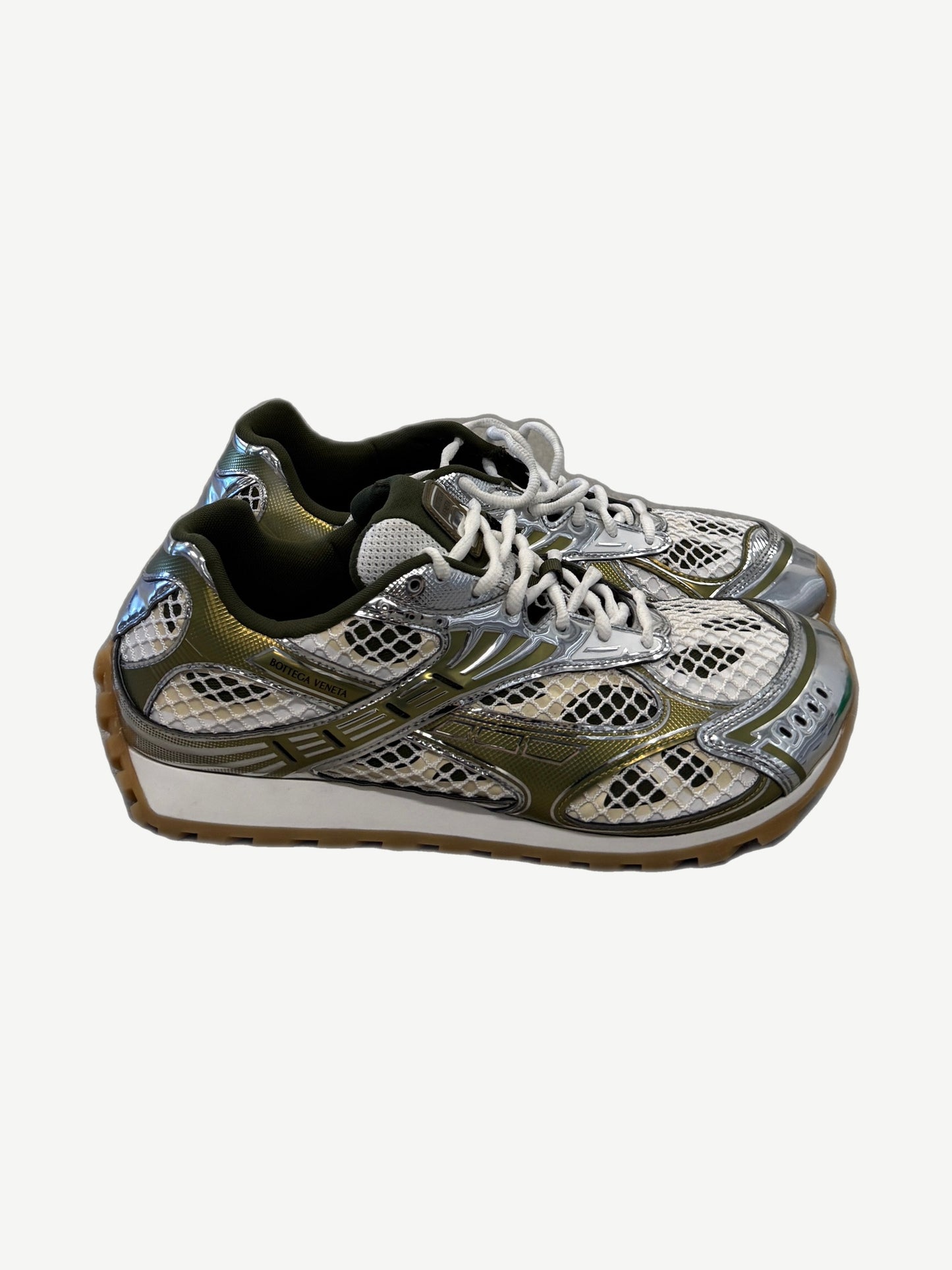 Bottega Veneta Orbit sneakers side view in olive green, mirror silver chrome and white mesh on gum sole