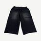 HMDD black Samurai sweat shorts back view, knee-length fleece silhouette with clean unprinted rear panel.