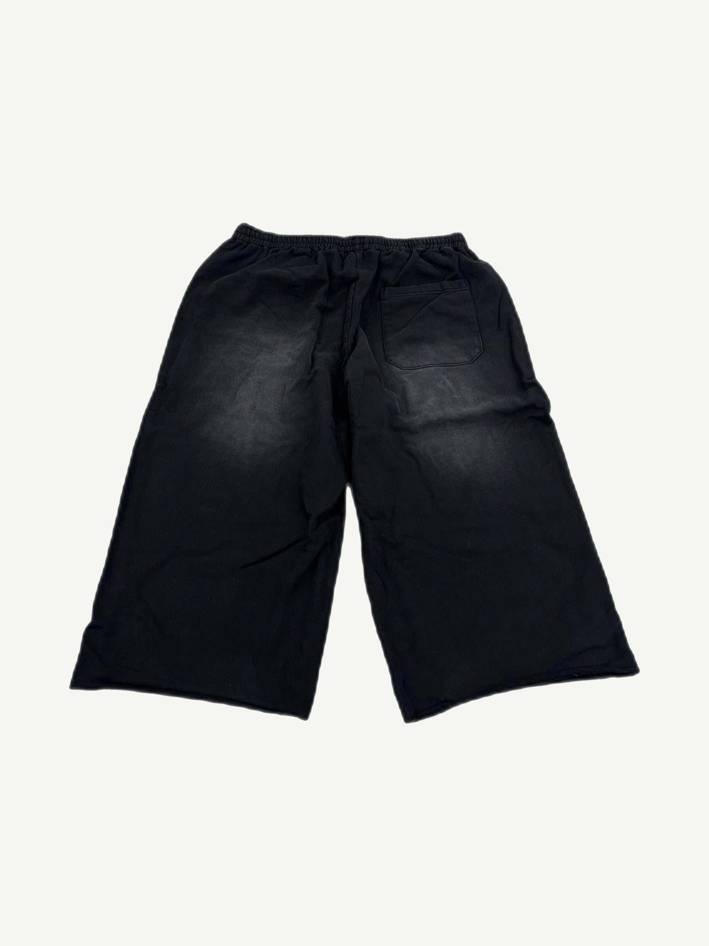 HMDD black Samurai sweat shorts back view, knee-length fleece silhouette with clean unprinted rear panel.