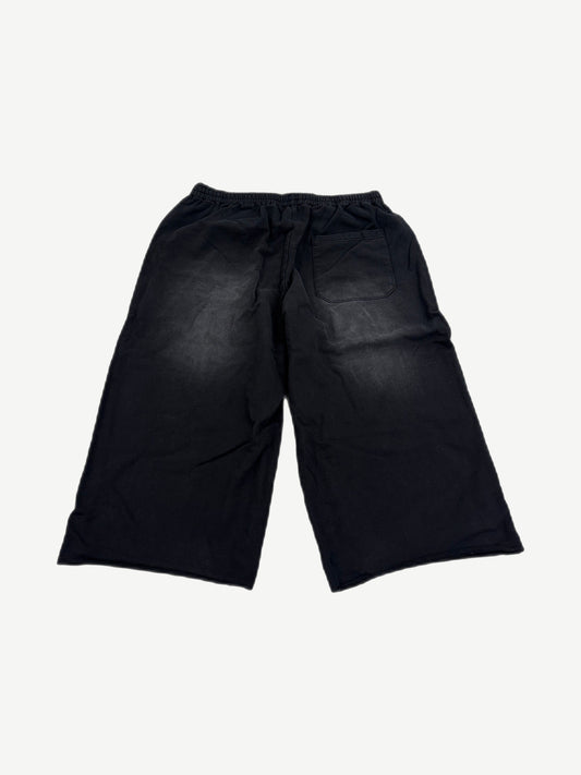 HMDD black Samurai sweat shorts back view, knee-length fleece silhouette with clean unprinted rear panel.
