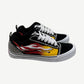 Custom Vans Knu Skool sneaker side view with rhinestone flame applique on suede upper and chunky waffle sole