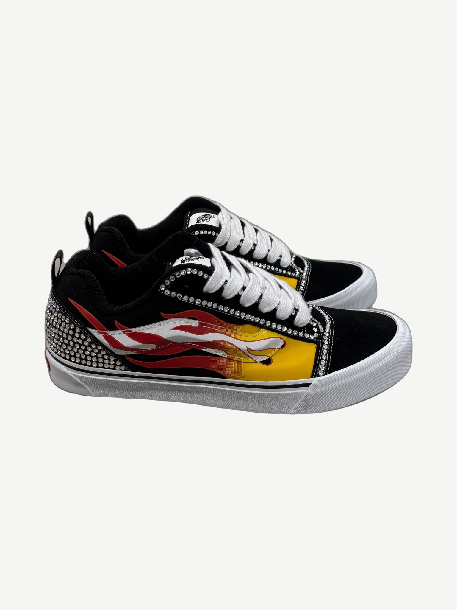 Custom Vans Knu Skool sneaker side view with rhinestone flame applique on suede upper and chunky waffle sole