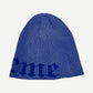 Supreme navy Old English printed beanie alternate angle showing folded cuff and woven brand logo tag