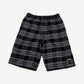 Chrome Hearts After School flannel shorts front, black and grey plaid with leather cross patch