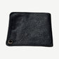 Chrome Hearts black leather bifold wallet back view with silver chain grommet and creased grain texture