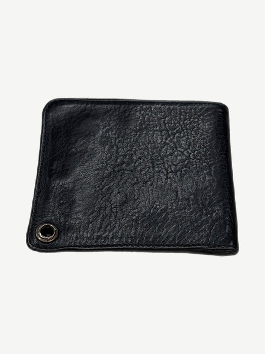 Chrome Hearts black leather bifold wallet back view with silver chain grommet and creased grain texture