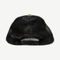 Chrome Hearts triple star trucker hat side profile showing curved brim and structured foam crown.