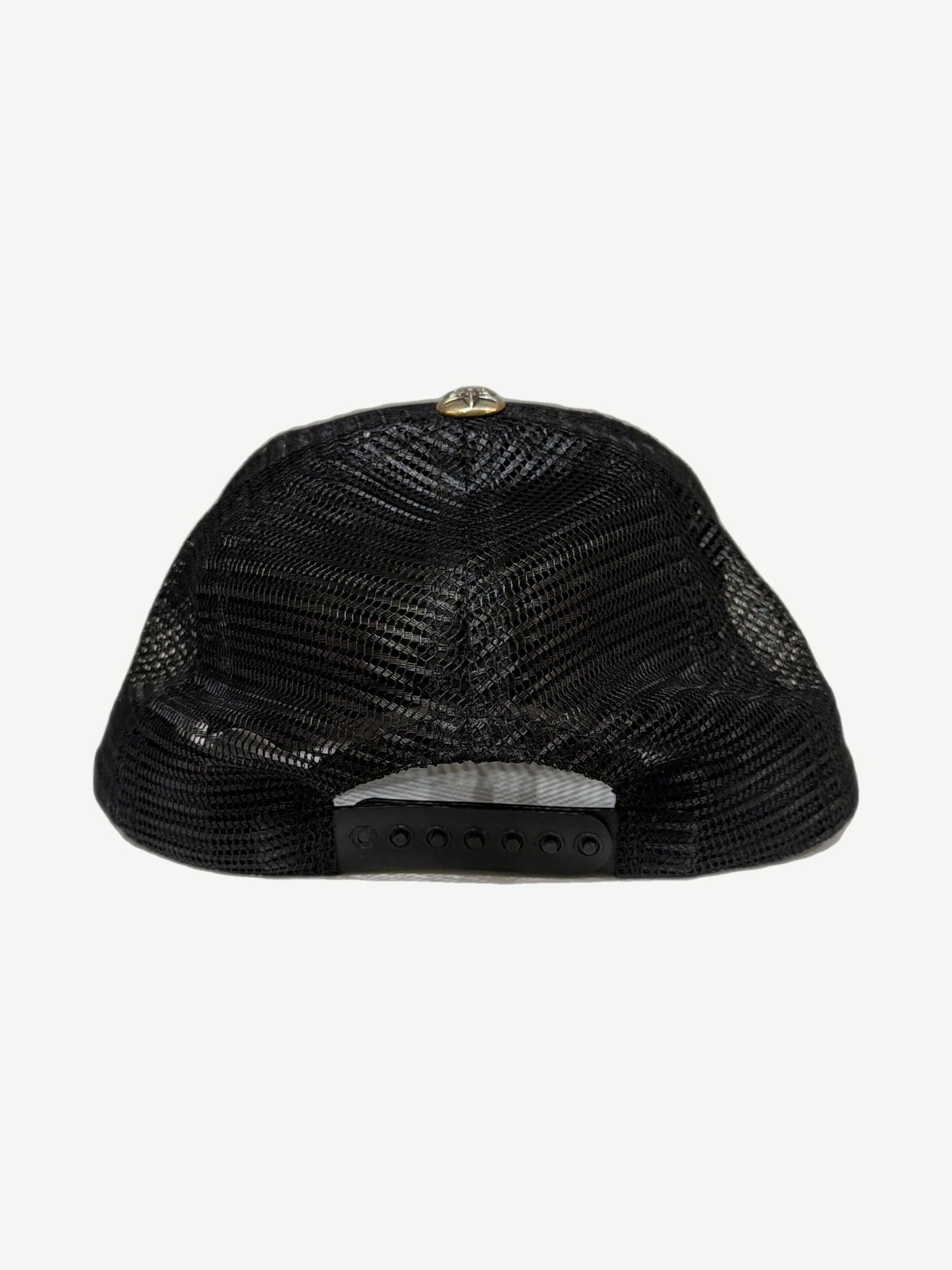 Chrome Hearts triple star trucker hat side profile showing curved brim and structured foam crown.