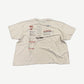 Paly Hollywood signature tee back view in white cotton with distressed holes and worn texture.