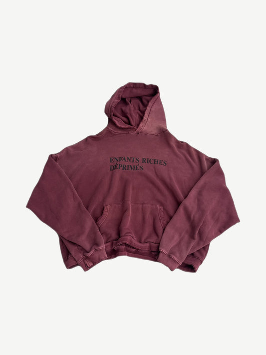 Enfants Riches Deprimes washed burgundy distressed hoodie with white painted logo across chest, heavy distressing.