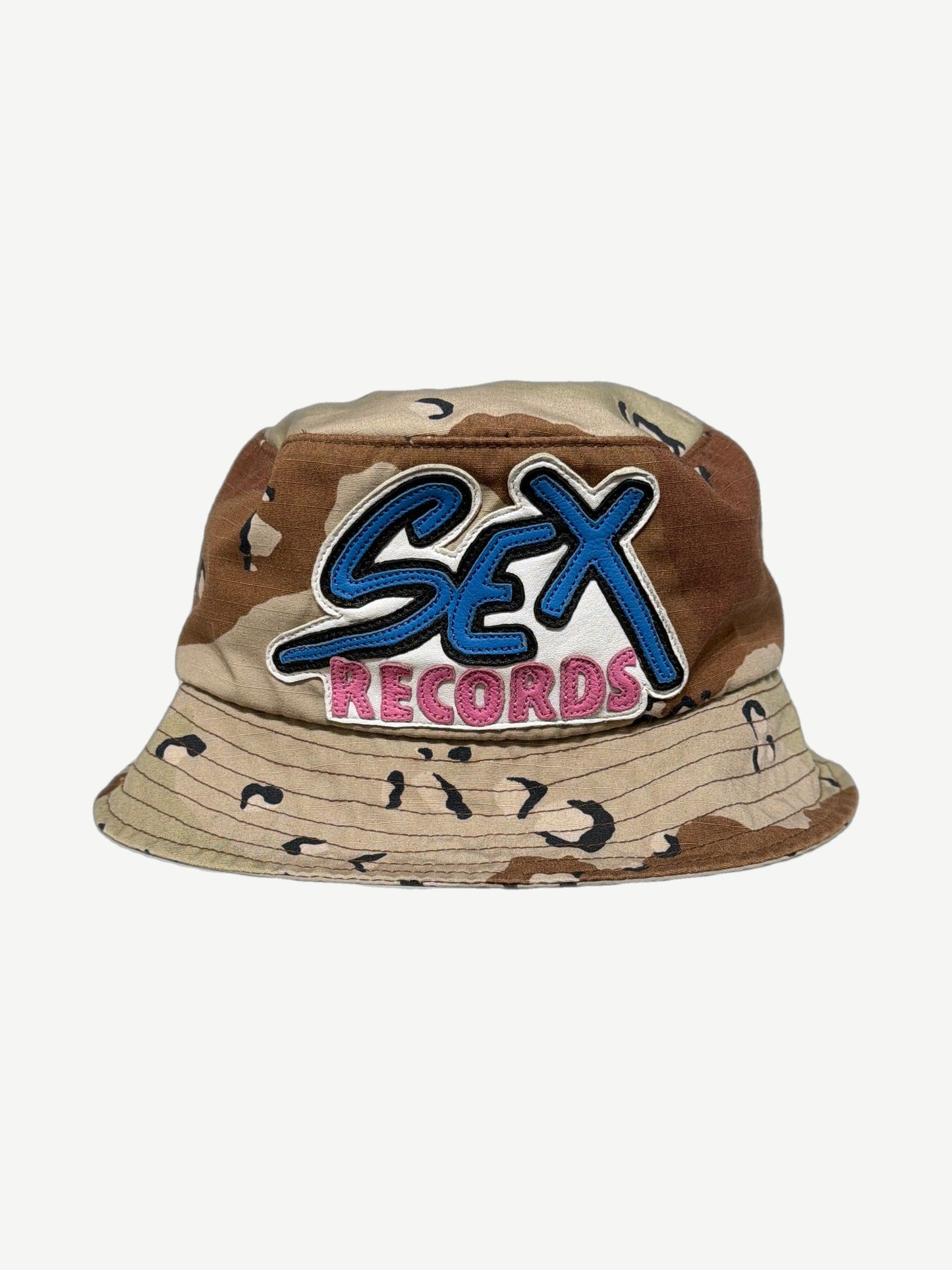 Chrome Hearts Matty Boy desert chocolate chip camo bucket hat front with blue SEX pink RECORDS leather patch
