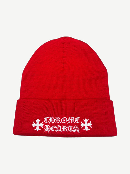 Chrome Hearts red knit beanie with white gothic Chrome Hearts wordmark and embroidered cross logos.