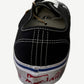 Heel detail of Gallery Dept black Vans Authentic showing Art That Kills red foxing stripe and stitching.
