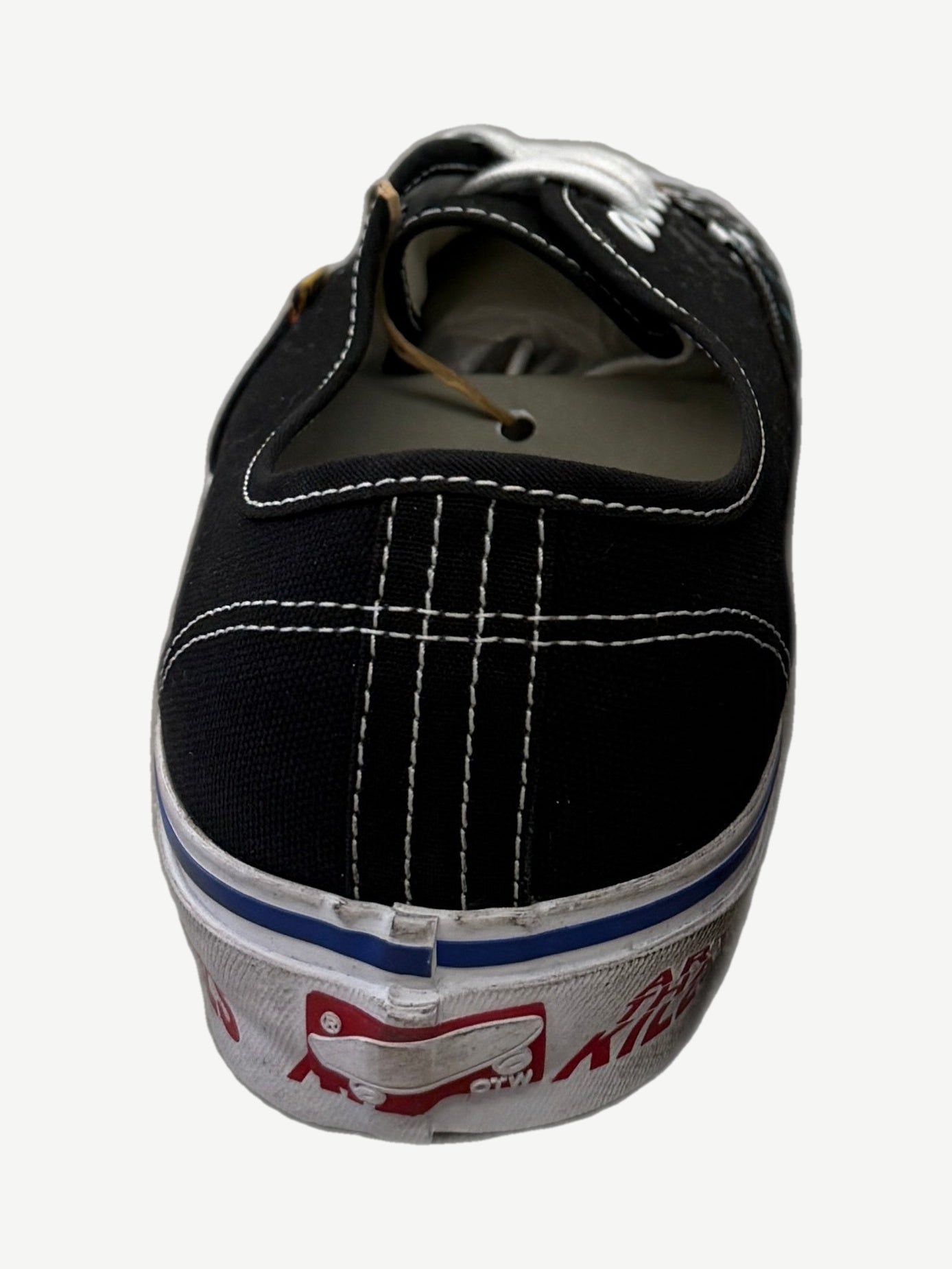 Heel detail of Gallery Dept black Vans Authentic showing Art That Kills red foxing stripe and stitching.