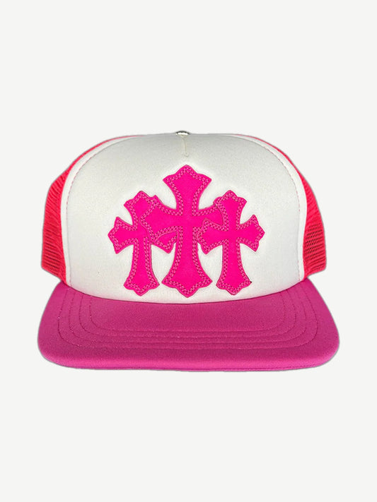 Chrome Hearts pink trucker hat with three hot pink cross patches stitched on white foam front panel
