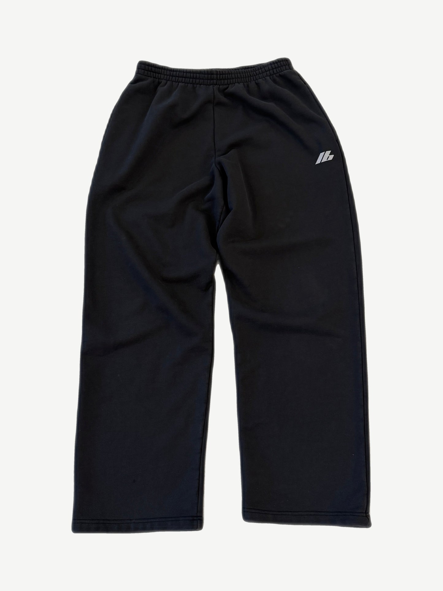 Balenciaga 3M logo sweatpants in black with reflective silver Balenciaga wordmark on left thigh.