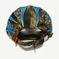 Living Product camo dad hat rear view with blue tribal flame embroidery, orange strap tab and adjustable buckle closure