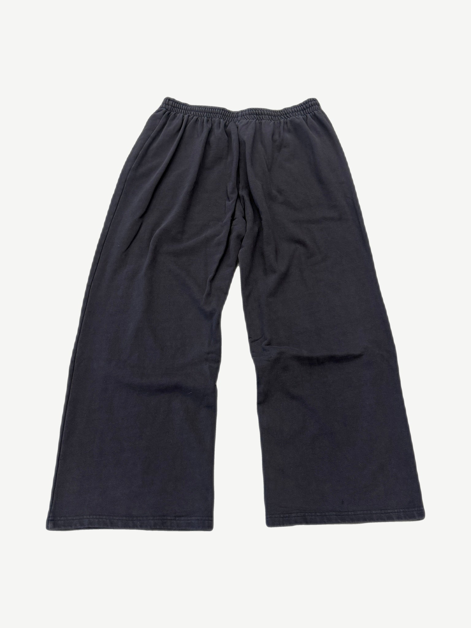 GV Gallery Raspberry Hills black sweatpants back view, baggy fit with drawstring waist and tapered cuffs.