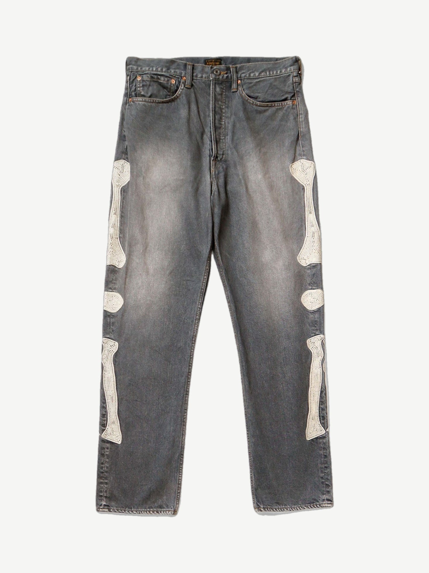Kapital washed black bone denim jeans with faded fading and signature white skeletal bone graphic on the leg