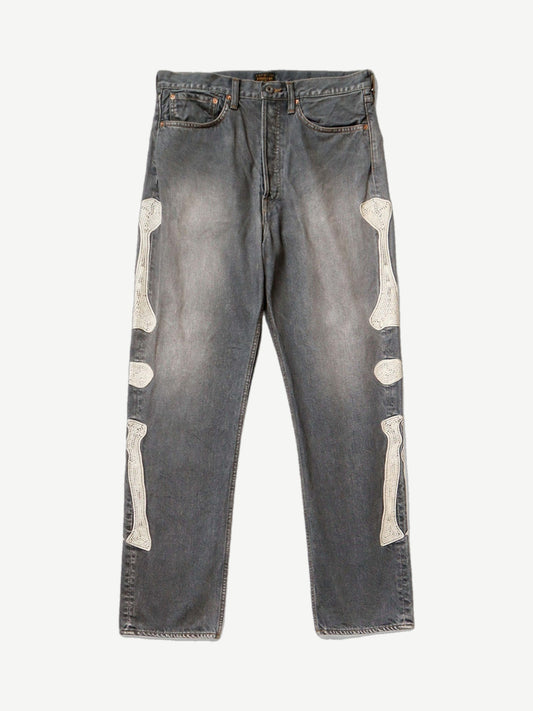 Kapital washed black bone denim jeans with faded fading and signature white skeletal bone graphic on the leg