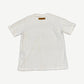 Louis Vuitton white tee back view with leather LV brand tab at neck on plain cotton